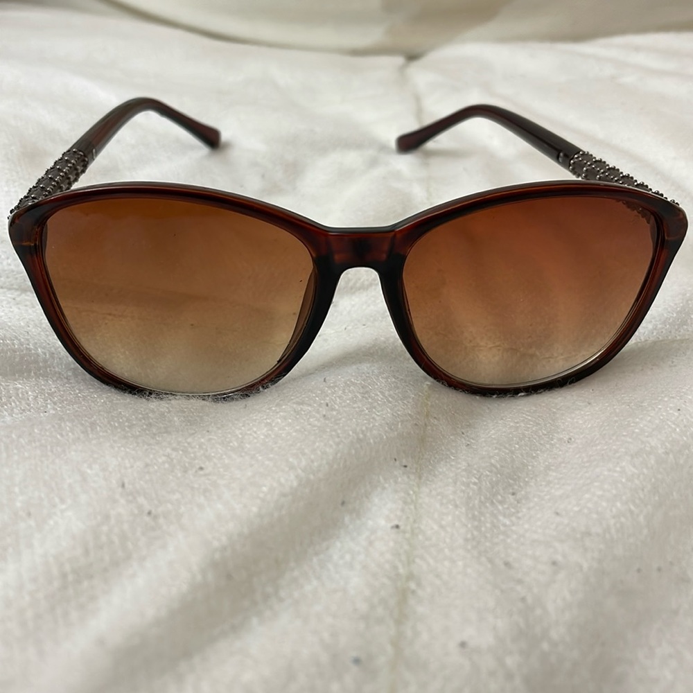 Dark Havana cat eye sunglasses. Chanel on lens. The side of the lens #is faded.